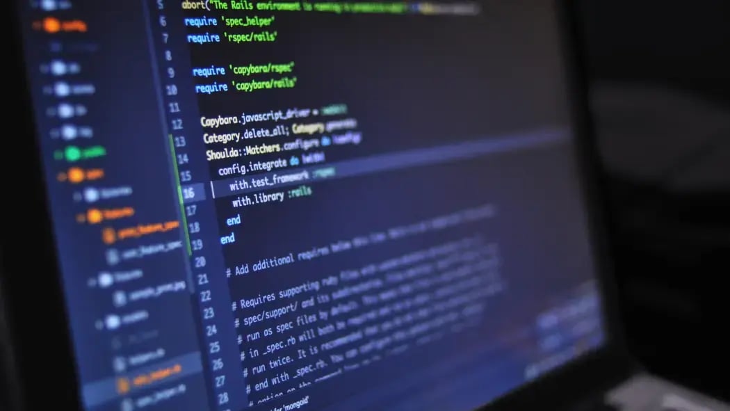 A laptop showing python code on it