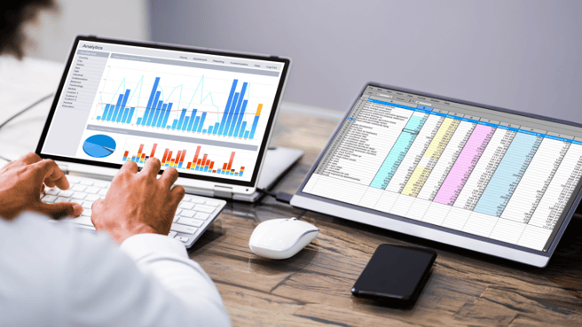 Data being shown on two laptop screens