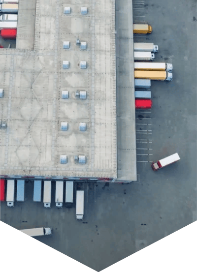 Photo of trucks parked outside a warehouse