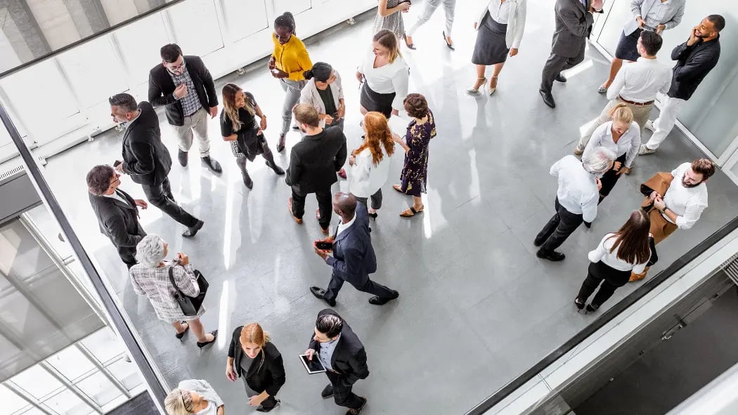 People walking around a networking event