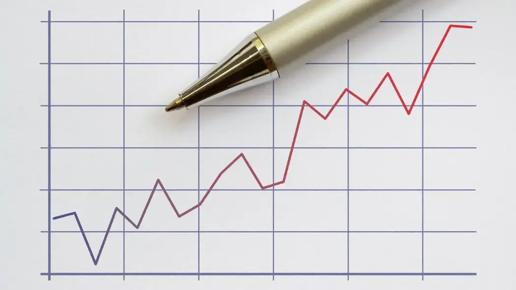 An image of a graph with a pen laying on it