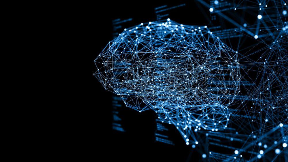 Blue particle image in a brain shape on a black background