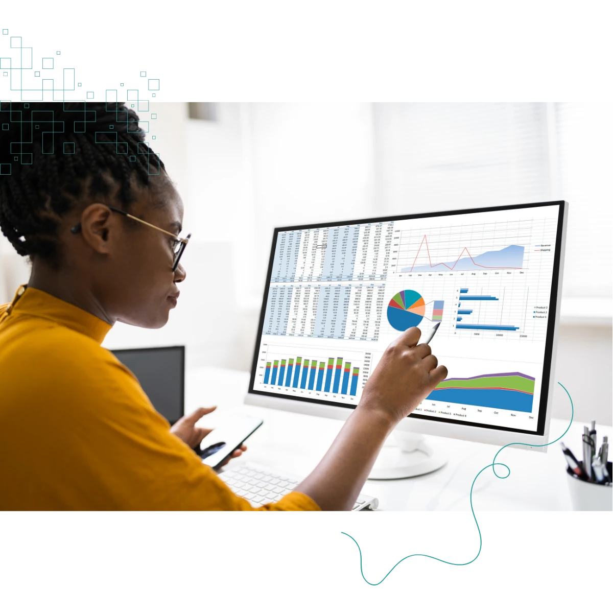 Black woman say at a desk in front of a computer screen displaying tables and charts Black woman say at a desk in front of a computer screen displaying tables and charts